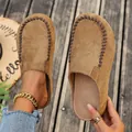 Detailed view of vintage brown suede clogs featuring contrast hand-stitched details - 36 / Camel