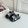 Close-up of baby walking shoes with star detail and adjustable straps - Size 22 Inner Length 14.5CM / Black