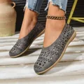 Comfortable gray hollow-out flat shoes for women featuring round toe and breathable laser-cut design - 36 / Gray