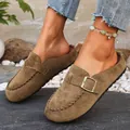 Detail view of brown suede clogs for women featuring a stylish metal buckle strap. - 36 / Camel