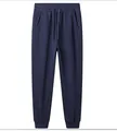 Detailed front view of navy blue cotton blend drawstring jogger pants for sports - M / Bottoms / Navy Blue