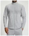 Close-up of men's athletic zip-up jacket featuring contrast color paneling details - S / Tops / Silver Gray