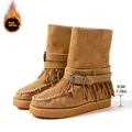 Detail of tan fringe snow boots with buckle strap and 3cm platform sole - Tan