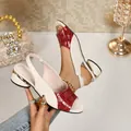 Elegant two-tone peep-toe sandals with red croc-pattern and gold-accented chunky heels - 36 / Red