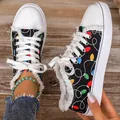 Women's casual canvas shoes with colorful festive light bulb print and fringe detail - 36 / Black