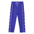 Detail view of blue athletic track pants with snap buttons and drawstring waist - S / Bottoms / Sapphire Blue
