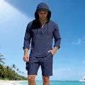 Detailed view of a men's blue linen casual set featuring a long-sleeve hooded Henley and shorts - Navy Blue