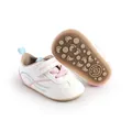 Detailed view of white soft-sole baby prewalker shoes featuring pink accents and rubber sole - 11cm / Pink