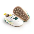 Detailed view of white baby pre-walker shoes with soft non-slip sole and Velcro strap - 11cm / Green