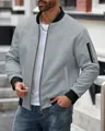 Close-up of men's grey waffle knit bomber jacket with zipper and pocket details - S / Tops / Light Gray