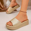 Close-up of elegant gold platform slide sandals featuring a textured finish and thick sole. - 36 / Gold