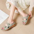 Comfortable sage green wedge sandals featuring laser-cut floral details on wood floor - 38 / Green
