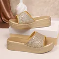Close-up detail of golden glitter straps and textured platform wedge slippers - 36 / Glitter Gold