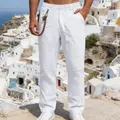 Men's loose white linen trousers featuring a straight-leg cut in a scenic outdoor setting - S / Bottoms / White