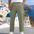 Men's loose linen straight-leg trousers in sage green, styled in a Mediterranean resort setting. - S / Bottoms / Army Green