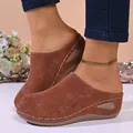 Side view of women's brown closed-toe platform mules with hollow-out patterns - Dark Brown