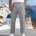 Close-up detail of men's loose linen casual trousers in light gray for summer style - Dark Gray