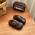 Close-up of retro brown leather children shoes with kiltie fringe and buckle detail. - 23 / Brown