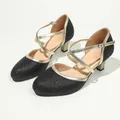 Detailed view of black glitter high-heeled dance shoes with gold crisscross straps - 36 / Black