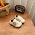 Retro cream-colored fringed leather toddler shoes with buckle on a rustic wooden table - 23 / Beige