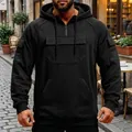 Detailed front view of a men's solid black multi-pocket half-zip hoodie for winter - S / Tops / Black
