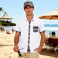 Detail view of a men's white short sleeve beach shirt with bohemian striped accents - S / Tops / White