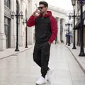 Men's two-piece fleece tracksuit set with hooded jacket and cargo joggers in street style - Black