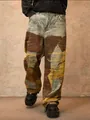 Vista dettagliata di jeans patchwork in stile high-street con bordi strappati - Taglia S / Pantaloni e gonne / Marrone