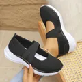 Detail view of women's breathable black mesh Mary Jane sneakers with cross straps - 36 / Black