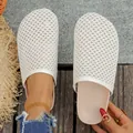 Detail shot of white woven mesh closed-toe mules showing textured upper and flat sole - 35 / Beige
