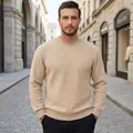 Detailed view of a premium men's beige cable knit sweater with a classic crew neck - S / Tops / Khaki