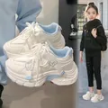 Stylish white butterfly chunky sneakers for girls shown in a trendy lifestyle street setting - 28 / Blue