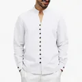 Close-up detail of men's white casual shirt with mandarin collar and stylish buttons - S / Tops / White