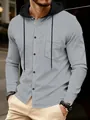 Close-up detail of a grey men's waffle knit long sleeve hoodie featuring buttons and pocket - S / Tops / Gray