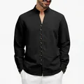 Close-up of a black ethnic style men's shirt with unique button details and stand collar - S / Tops / Black