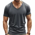 Close-up of men's athletic grey V-neck t-shirt highlighting fit and muscle definition. - Dark Gray