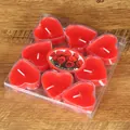 Detailed view of 9-pack red heart-shaped tea light candles in clear PVC packaging - 9 Pieces Set / Red