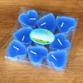 Detail view of 9-pack blue heart-shaped tea light candles in transparent PVC box - 9 Pieces Set / Blue