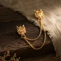 Detailed view of a vintage gold dragon head brooch with elegant double chains - Gold