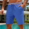 Detail of blue textured men's shorts with red and black striped elastic waistband. - S / Bottoms / Sapphire Blue