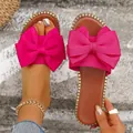 Elegantes chanclas planas rosa vibrante con un lazo grande para mujeres modernas y chic - 36 / Rosa rojo