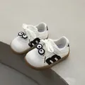 White toddler walking shoes with soft non-slip soles and cute cartoon eye design - Size 21 / Inner Length 13.5cm / Black