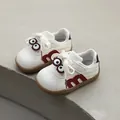 Cute cartoon toddler walking shoes with soft soles, white leather and red M-shaped decoration - Size 21 / Inner Length 13.5cm / Burgundy