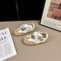 Macro view of kids beige mesh sneakers featuring an elegant white lace strap design - 26 / Camel