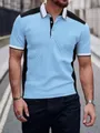 Détail d'un polo jacquard pour homme avec empiècements bleus et noirs - Bleu clair