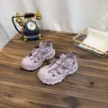 Close-up of lavender breathable mesh children's sports sandals on a vintage wooden table - 32 / Pink
