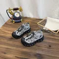 Breathable grey mesh children's sports sandals displayed on a rustic wooden table - 32 / Gray