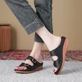 Sandales compensées noires élégantes pour femmes avec boucles et semelle plateau - 38 / Noir