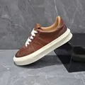 Men's classic brown leather sneakers with thick cream sole and white laces for spring - Brown