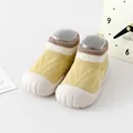 Calzini primi passi per neonati in maglia gialla con suola in gomma bianca morbida e antiscivolo - Lunghezza Interna 11 (Marchio Suola 11.5) / Giallo brillante
